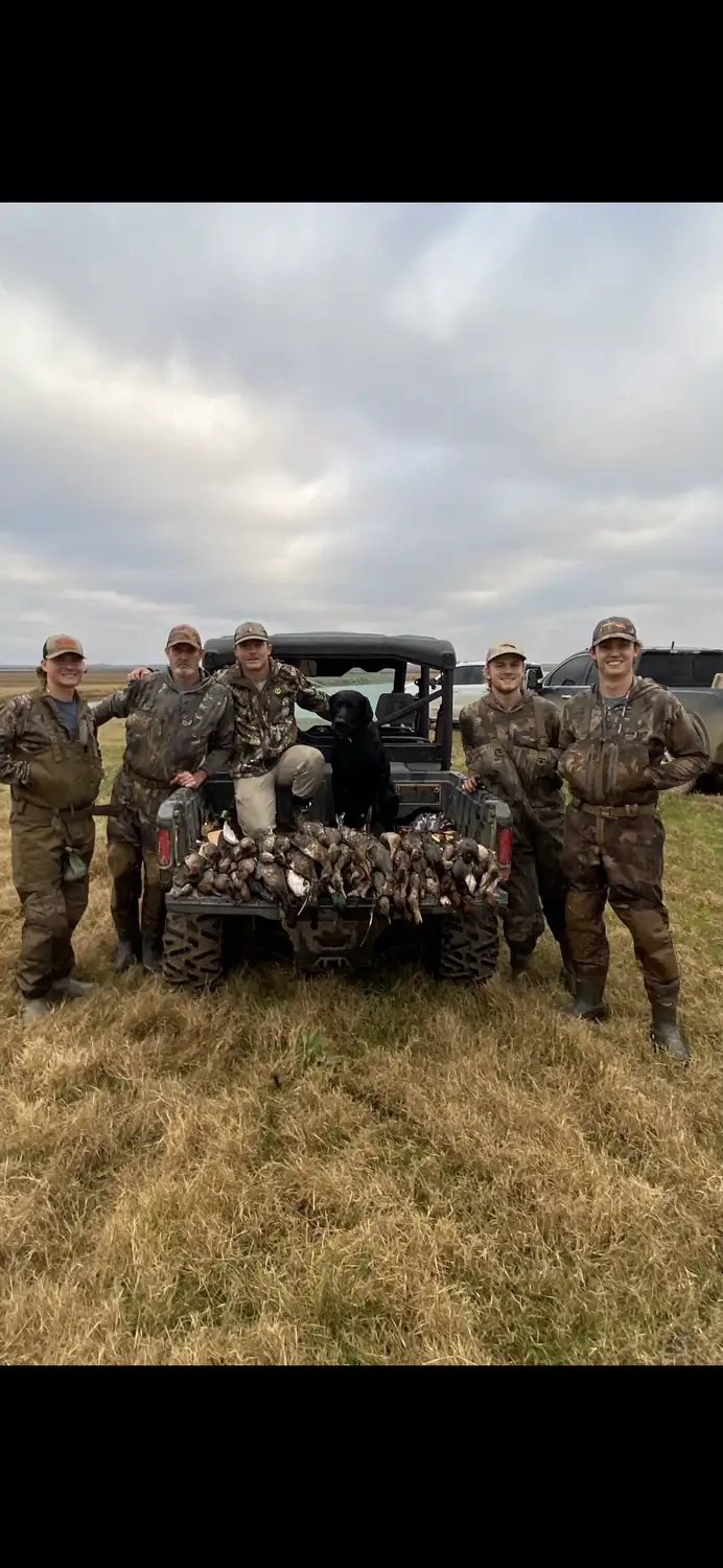 Hunters gathered at the blind with the morning's birds